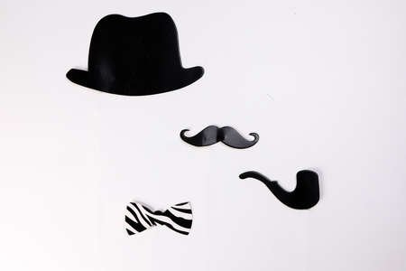 Black hat smoking pipe moustache blue neck bow tie shape paper die cut selfie portrait party fun paper prop sticker stick on white backgroundの写真素材