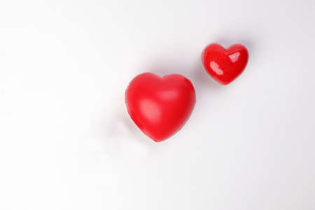small large three dimension 3d red hart shape symbol on top of white background copy text space top viewの写真素材