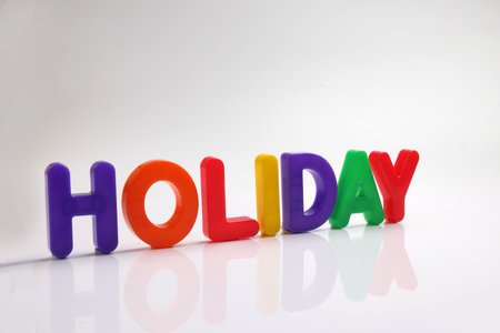 red green blue yellow plastic toy capital font letter alphabet holiday on white background copy text space conceptの写真素材