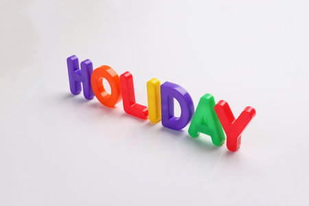 red green blue yellow plastic toy capital font letter alphabet holiday on white background copy text space conceptの写真素材