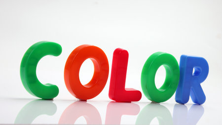 red green blue yellow plastic toy capital font letter alphabet color on white background copy text space conceptの写真素材
