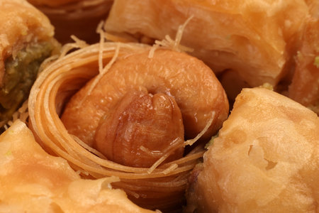 Layered stuffed pastry Baklava middle eastern sweet dessert on white backgroundの写真素材