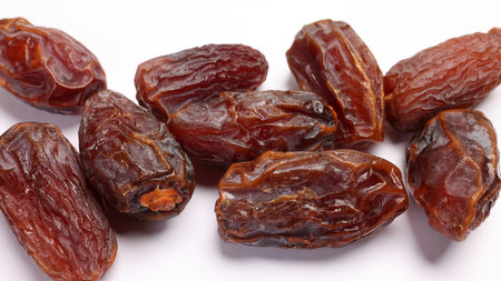 Dry ripe sweet date fruit on white backgroundの写真素材