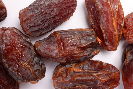 Dry ripe sweet date fruit on white backgroundの写真素材
