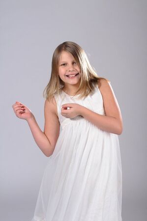 Funny little girl is smiling.の写真素材