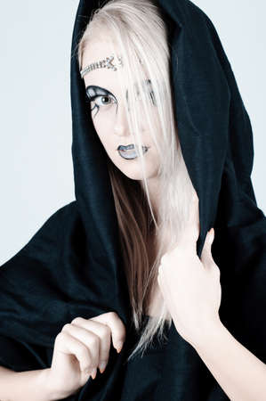 Beautiful girl with an original make up.の写真素材