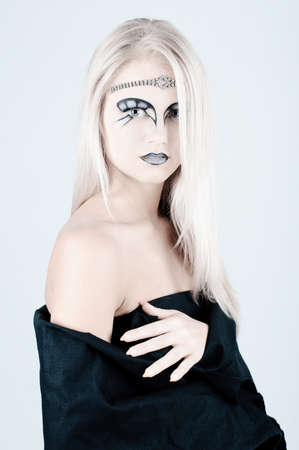 Beautiful girl with an original make up.の写真素材