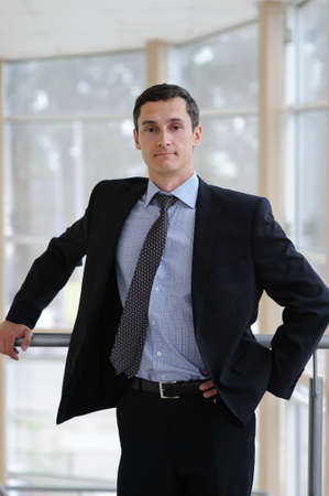 Portrait of young manager in black jacketの写真素材