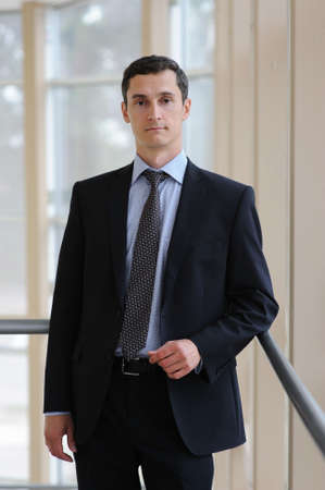 Portrait of young manager in black jacketの写真素材