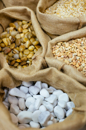Sacks with decorative stones. Close up.の写真素材