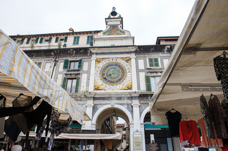 BRESCIA, ITALY - MARCH 21, 2015: Street scenes of the city. Fair in the town square.のeditorial素材
