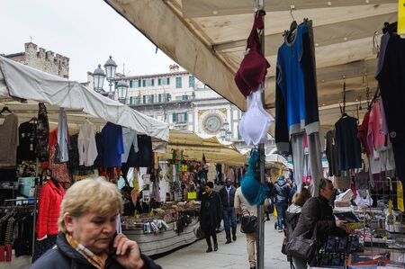 BRESCIA, ITALY - MARCH 21, 2015: Street scenes of the city. Fair in the town square.のeditorial素材