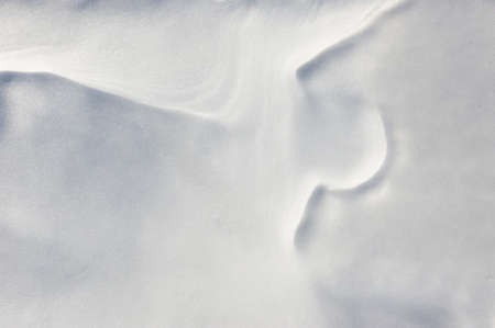 Thin crust of ice over snow.の写真素材