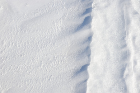 Thin crust of ice over snow.