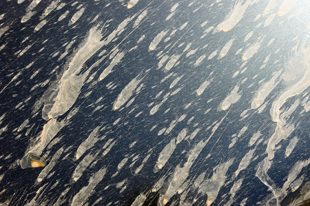 Abstract painting. Falling space objects. Actually, the mud splashes and sunny glares on the hood of...