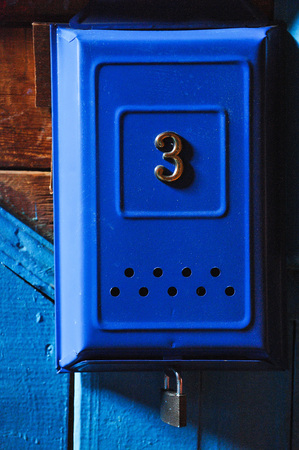 Number 3 on blue mailbox.の写真素材