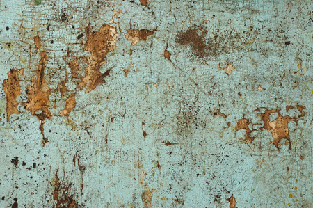 Cracked blue paint on an old wooden surfaceの写真素材