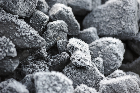 A pile of coal covered with thick crystals of frost.の写真素材