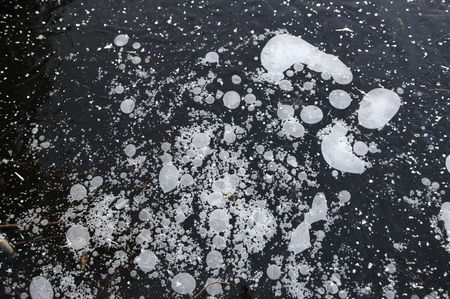 Air bubbles frozen in the water in a bizarre form .の写真素材