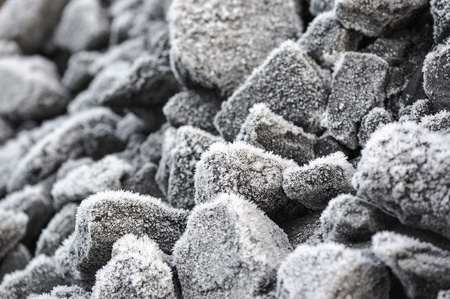 A pile of coal covered with thick crystals of frost.の写真素材