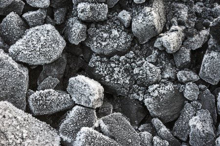 A pile of coal covered with thick crystals of frost.の写真素材