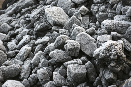 A pile of coal covered with thick crystals of frost.の写真素材