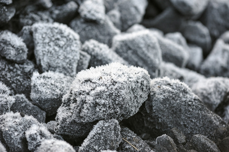 A pile of coal covered with thick crystals of frost.の写真素材