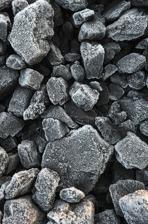 A pile of coal covered with thick crystals of frost.の写真素材