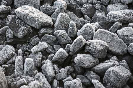 A pile of coal covered with thick crystals of frost.の写真素材