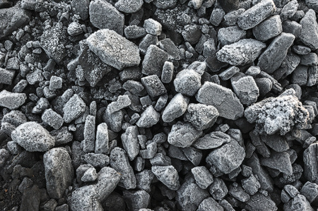 A pile of coal covered with thick crystals of frost.の写真素材