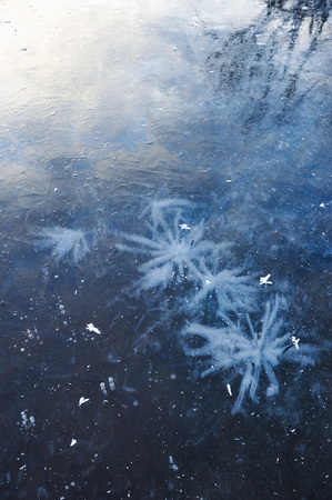 Air bubbles frozen in the water in a bizarre form .の写真素材