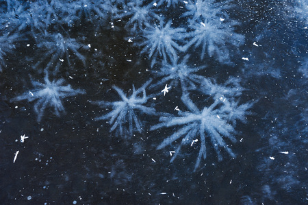 Air bubbles frozen in the water in a bizarre form .の写真素材