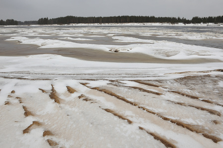 Desert landscape on the banks of the Vychegda river in late November.の写真素材
