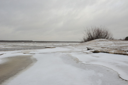 Desert landscape on the banks of the Vychegda river in late November.の写真素材