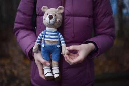 Teddybear toy knitted in the technique of knitting amigurumiの写真素材