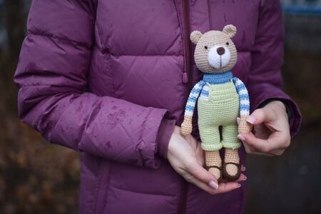 Teddybear toy knitted in the technique of knitting amigurumiの写真素材