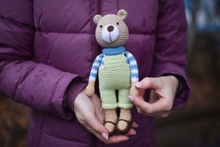 Teddybear toy knitted in the technique of knitting amigurumiの写真素材