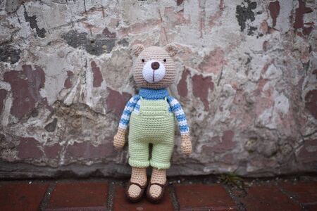 Teddybear toy knitted in the technique of knitting amigurumiの写真素材