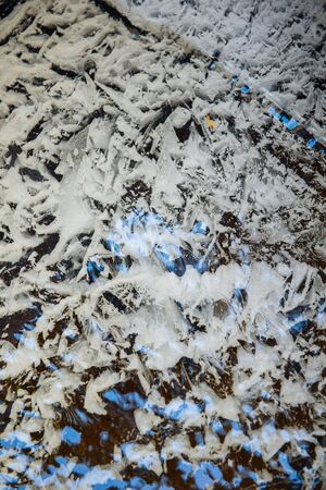 Forest stream frozen from night frosts.の写真素材
