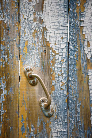 Close-up background. Wooden boards with peeling and cracked paint from time to time.の写真素材