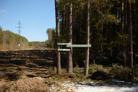 A coat hanger attached in the woods near the ski trail for those who are actively engaged in sportsの写真素材
