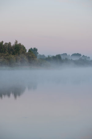 Morning fog in the river valley.の写真素材