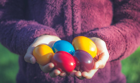 Hands holding  painted easter eggsの写真素材