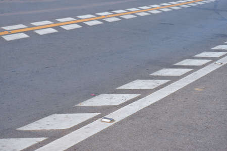 Pedestrian crossing on the road in the city, close-upの写真素材