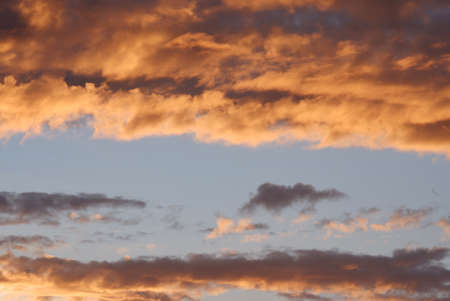 Blurred a group of dark clouds before rain with orange sky color