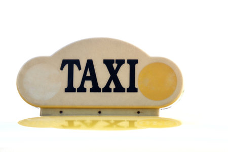 A sign of Taxi on white isolated background with copy spaceの写真素材