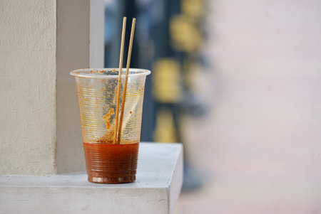 Close up a glass of food littering on the white floor for an environmental cleaning conceptの写真素材