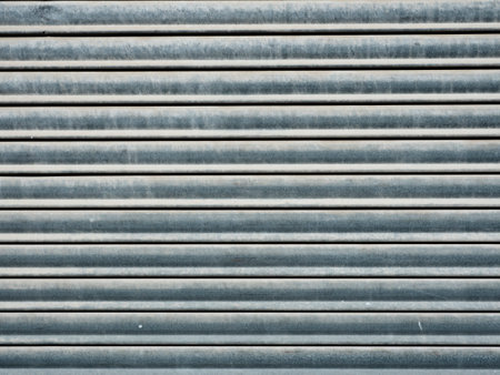 Close-up of a corrugated metal sheet with horizontal stripes