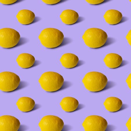 Lemons on lilac background, flat lay, top view, pattern.の写真素材