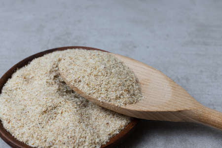 Psyllium in a clay cup on a concrete background. Food bacground. Horizontal orientationの写真素材
